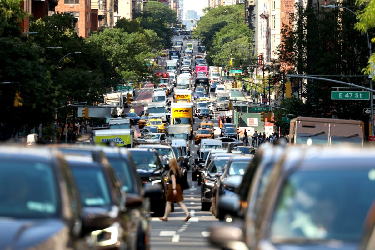 Cars and pedestrians move along Second Avenue in the Manhattan borough of New York City on July 29, 2025. (Charly Triballeau/AFP via Getty Images)