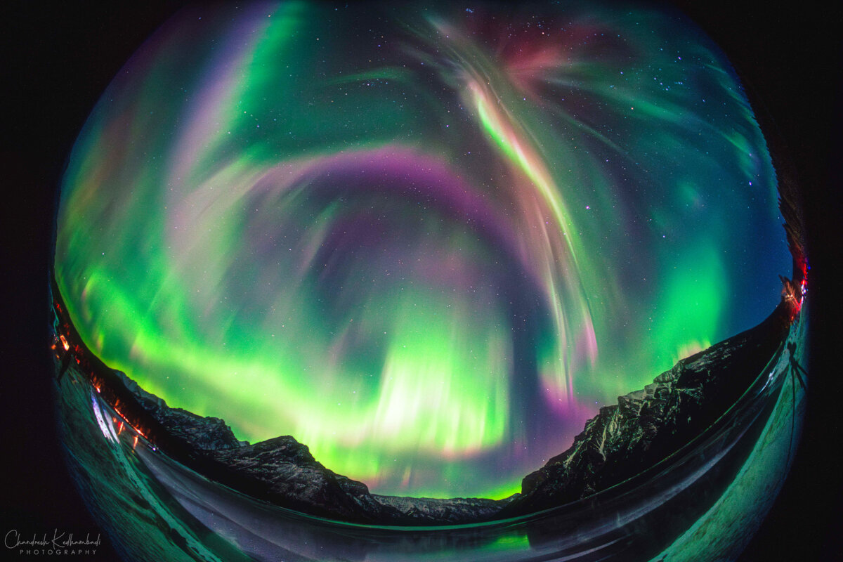 A fisheye lens captures an aurora storm over Lake Minnewanka in Banff National Park, Alberta, on Jan. 20, 2026. (Courtesy of Chandresh Kedhambadi)