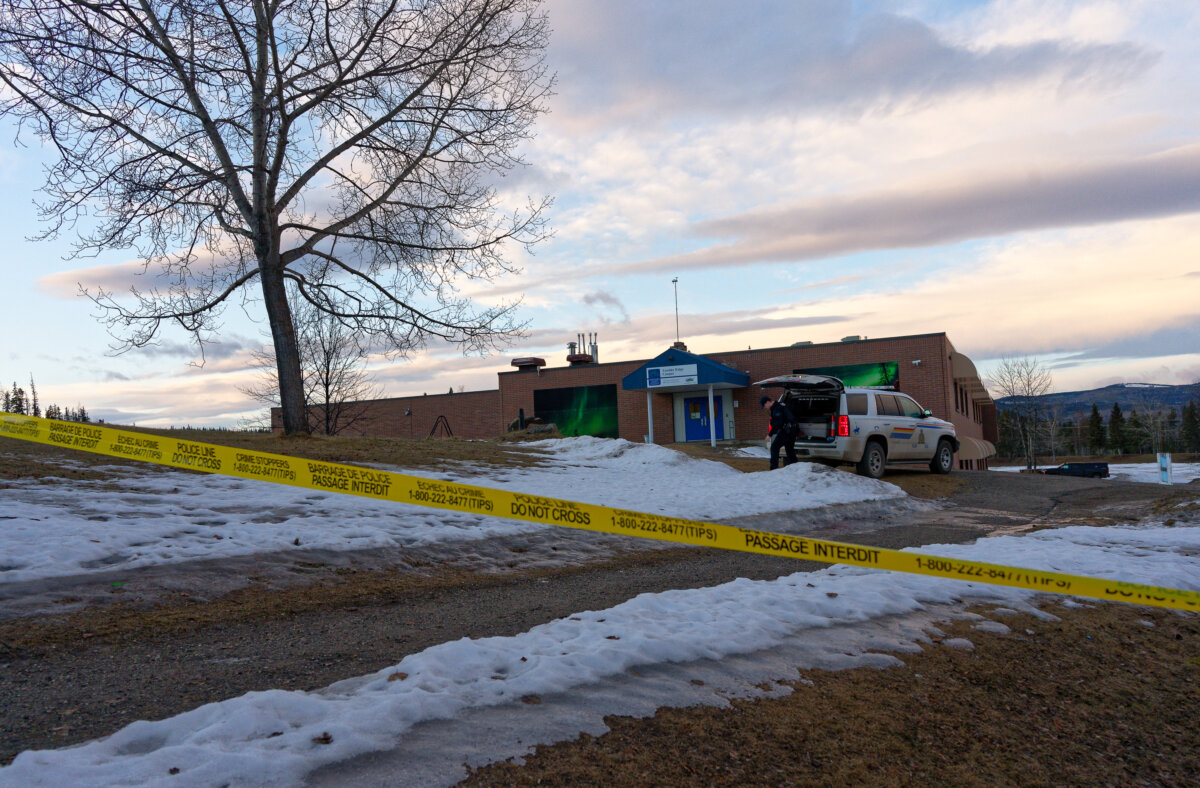 Police tape near the Tumbler Ridge Secondary School and surrounding buildings in Tumbler Ridge, B.C. on Feb. 11, 2026. (Jesse Boily /The Canadian Press via AP)