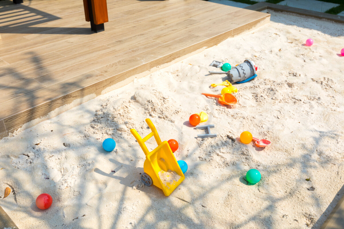 With all the potential problems and threats to children these days, what could be a safer, cleaner (well, fairly clean) fun activity than being creative in a sandbox in your backyard? (ben bryant/Shutterstock)