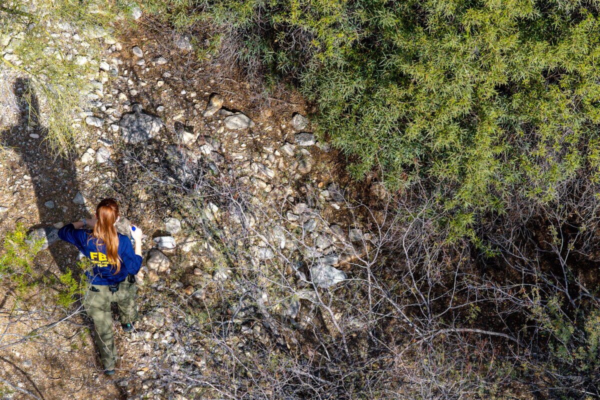 A member of the FBI surveils an area around Nancy Guthrie's residence in Tucson, Ariz., on Feb. 11, 2026. (Brandon Bell/Getty Images)