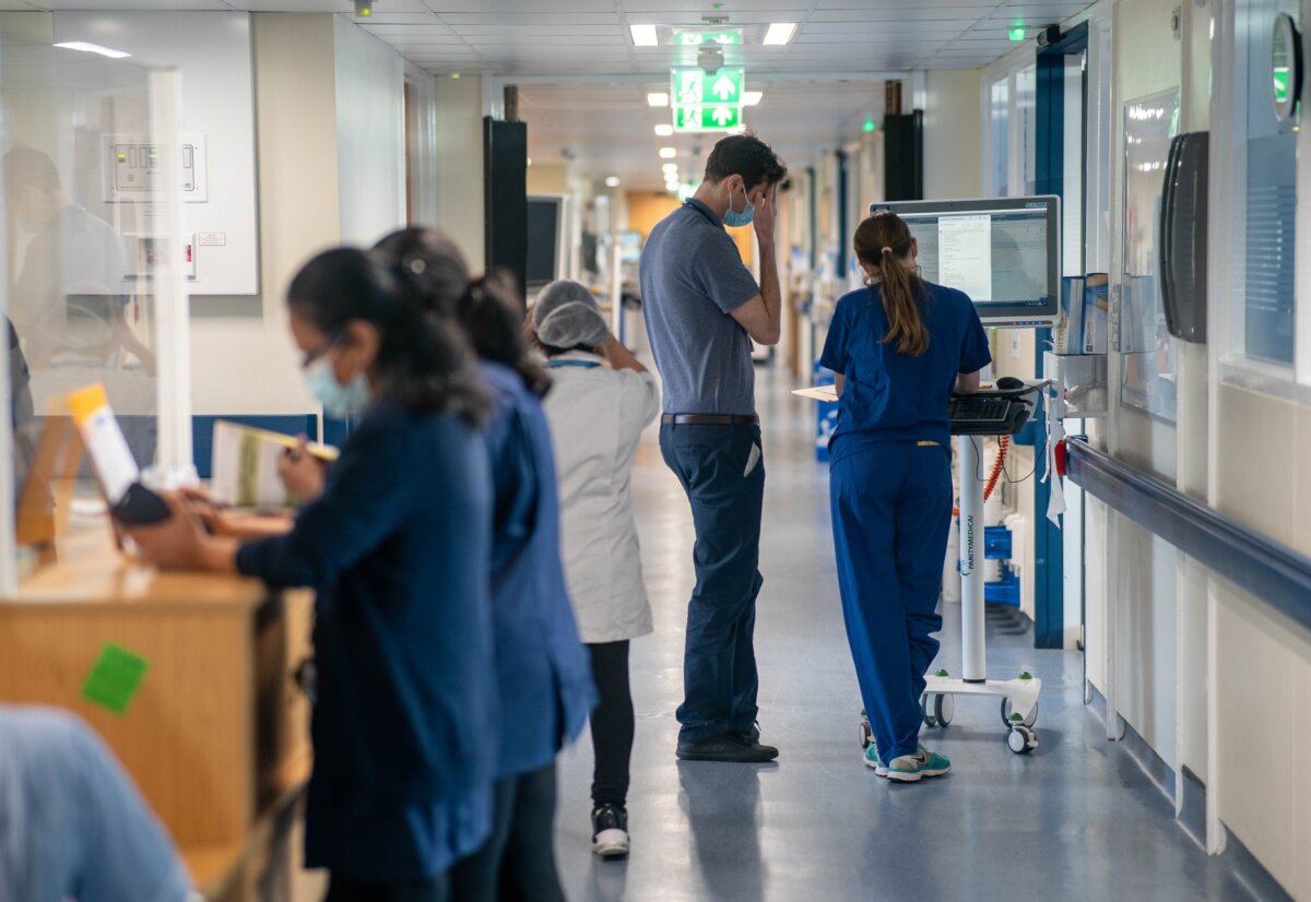 Staff on an NHS hospital ward at Ealing Hospital in London (PA)
