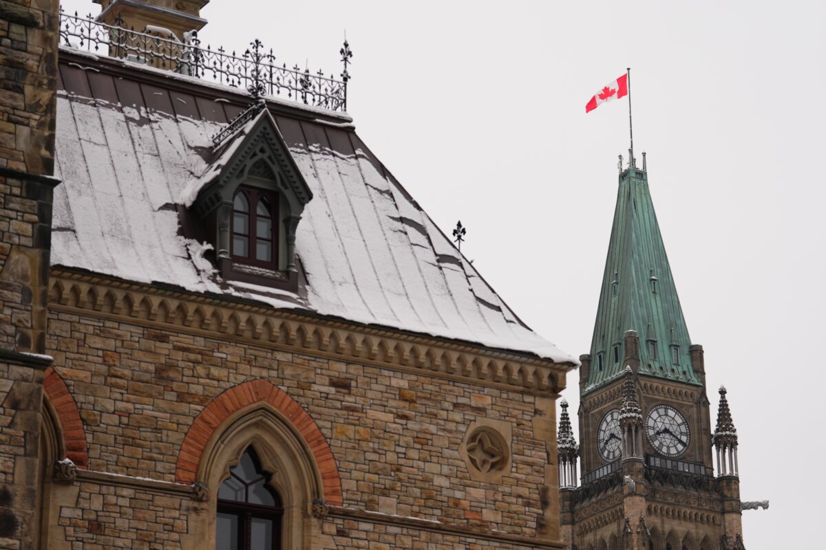 A Canadian flag flies atop the Peace Tower on Parliament Hill in Ottawa, on March 10, 2025. (The Canadian Press/Sean Kilpatrick)