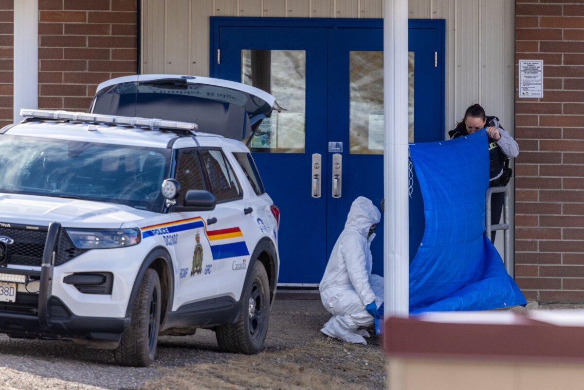 Investigators work at the Tumbler Ridge Secondary School in Tumbler Ridge, B.C., on Feb.11, 2026. (Eagle Vision Agency/AFP via Getty Images)