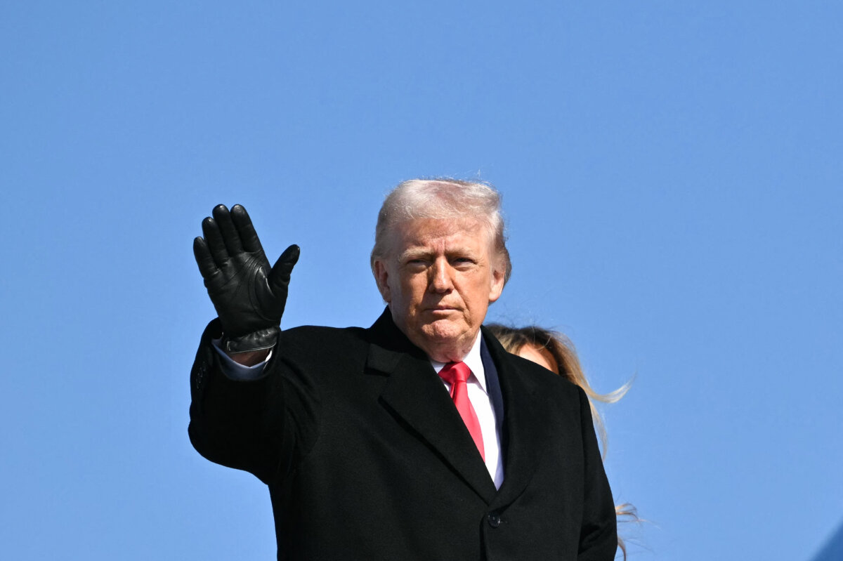 President Donald Trump waves as he boards Air Force One before departing from Joint Base Andrews in Maryland on Feb. 13, 2026. (Mandel Ngan/AFP via Getty Images)