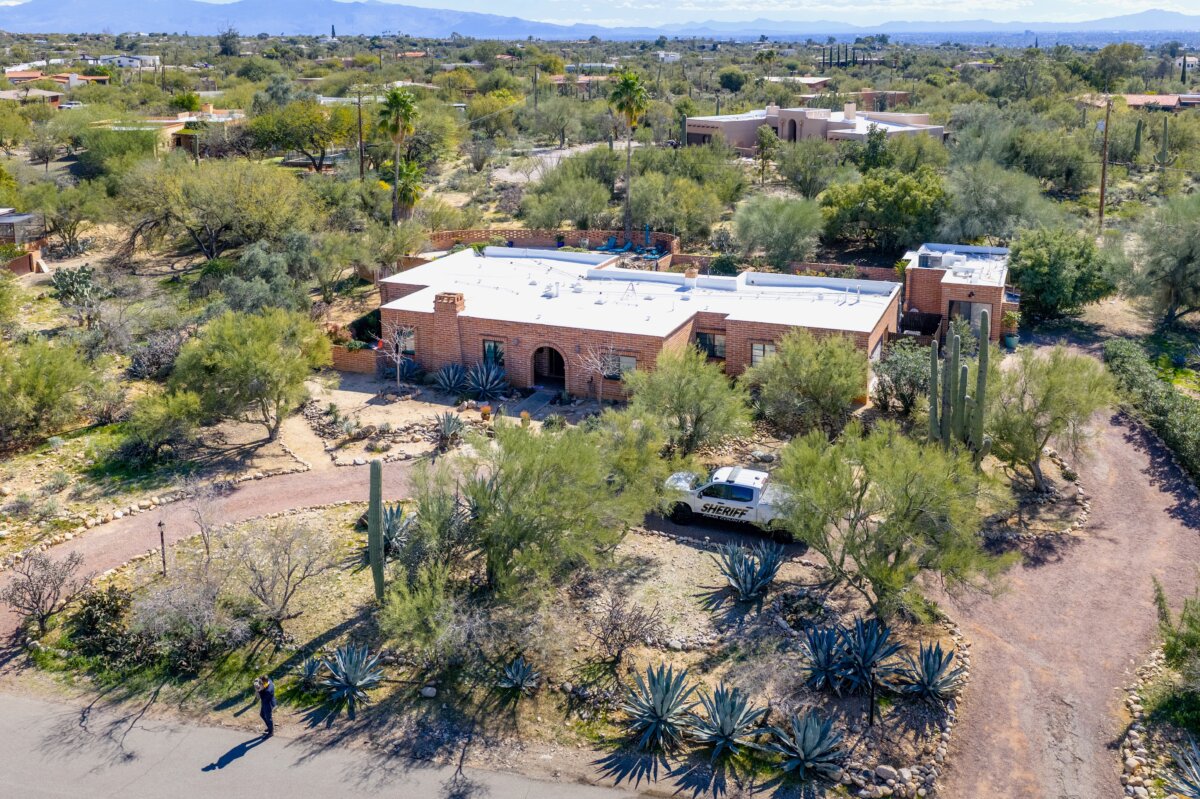 A law enforcement vehicle is stationed outside of Nancy Guthrie's residence in Tucson, Ariz., on Feb. 11, 2026. (Brandon Bell/Getty Images)
