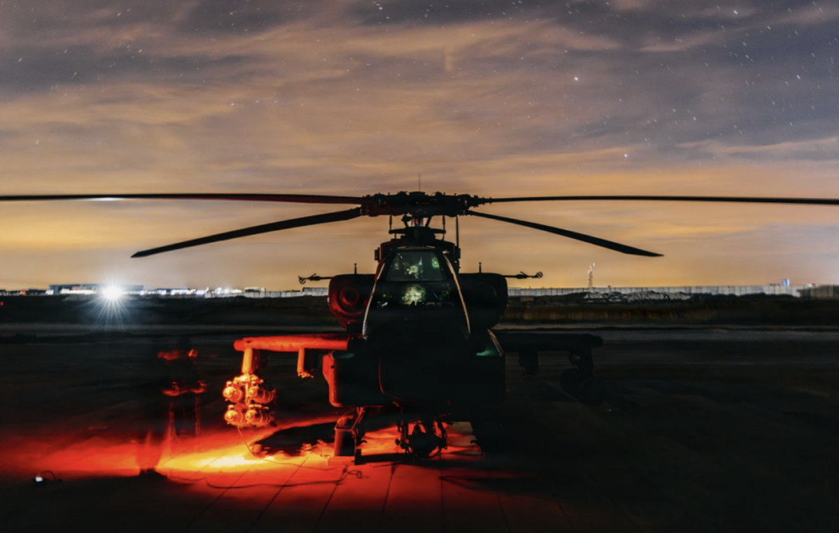 U.S. soldiers prepare an AH-64 Apache helicopter for strike operations in Syria on Dec. 19, 2025. (Sgt. Zachary Ta/U.S. Army via DVIDS)