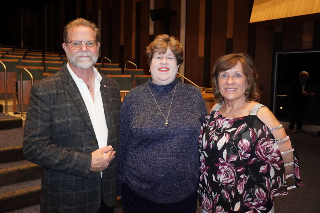 Chris Farr and his wife, Lisa Farr (R), with Mrs. Farr's cousin Michelle Forrmanski at the CFISD Visual and Performing Arts Center in Houston, Texas, on Feb. 14, 2026. (Sonia Wu/The Epoch Times)