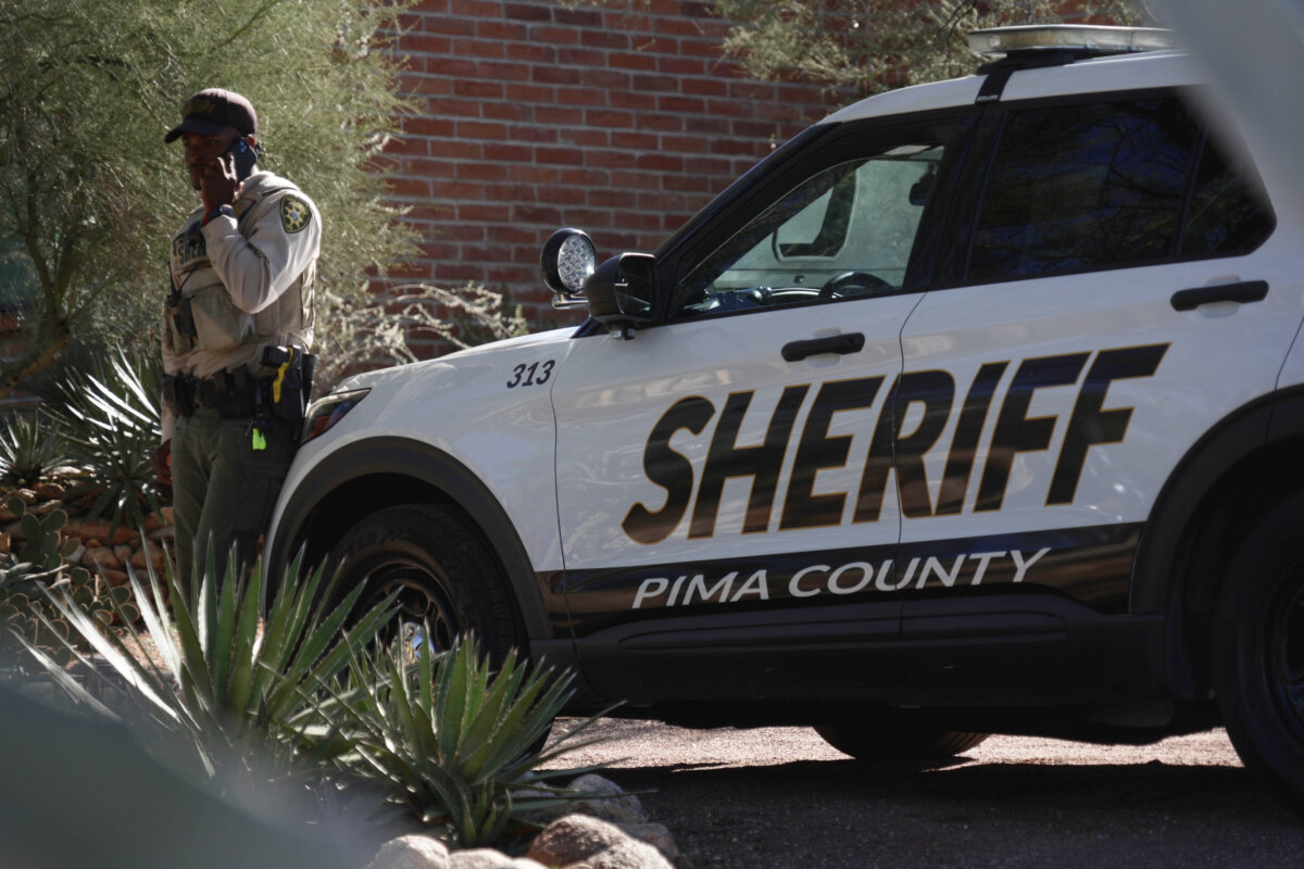 A Pima County sheriffs official stays outside of Nancy Guthrie‘s home on Feb. 14, 2026 in Tucson, Ariz. (Ty O'Neil/AP Photo)