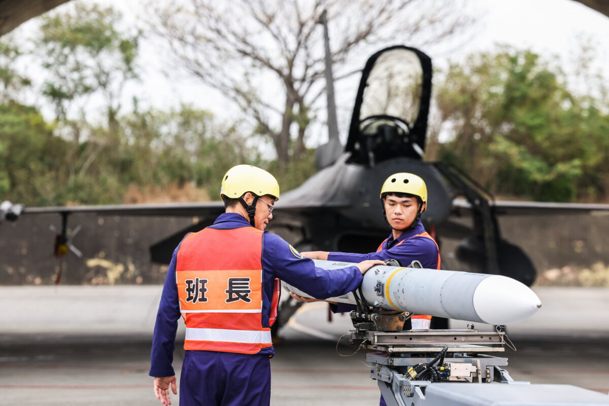 An AIM-120 Advanced Medium-Range Air-to-Air missile is being prepared to be loaded onto a F-16V fighter jet during Spring military exercise at Chiayi Air Base, in Chiayi, Taiwan, on Jan. 28, 2026. (I-Hwa Cheng/AFP via Getty Images)