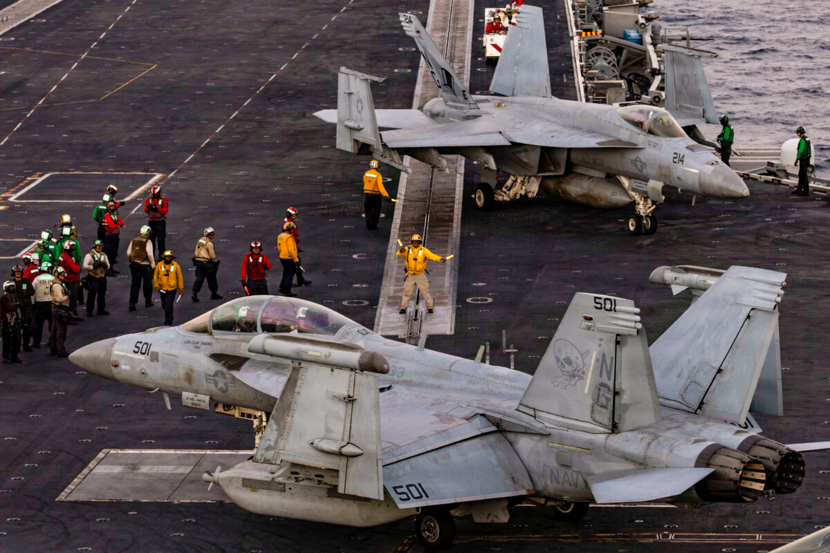 U.S. Sailors direct an EA-18G Growler on the flight deck of the aircraft carrier USS Abraham Lincoln (CVN 72) in the Arabian Sea, Feb. 3, 2026. (Mass Communication Specialist Seaman Zoe Simpson/U.S. Navy via DVIDS)