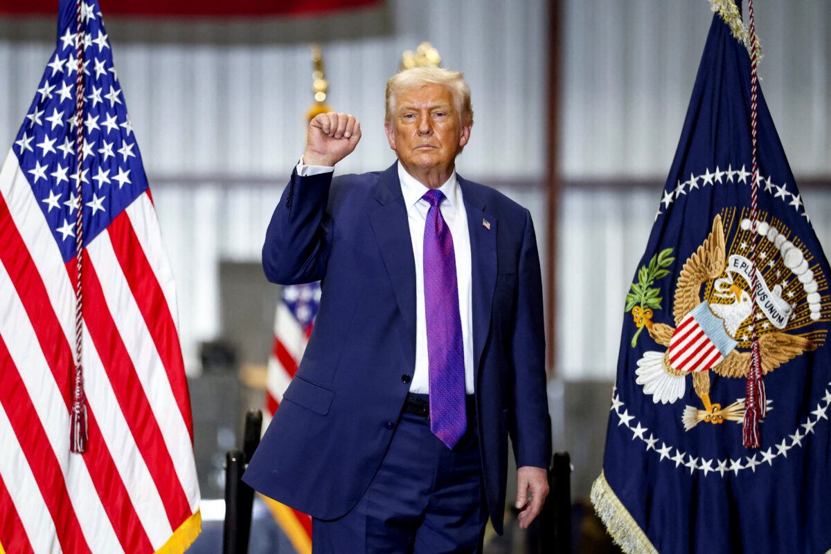 President Donald Trump makes a fist at the end of an event during a visit to Coosa Steel Corporation, in Rome, Ga., on Feb. 19, 2026. (Kevin Lamarque/Reuters)