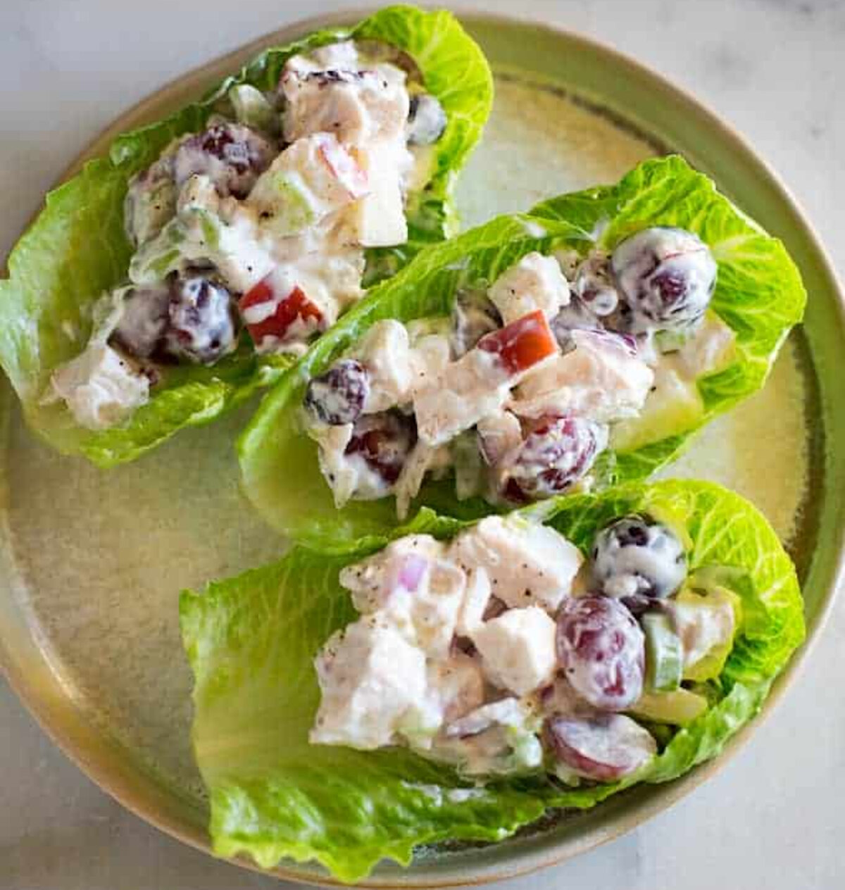 Healthy Chicken Salad Lettuce Wraps made with shredded chicken, apples, grapes, celery, almonds, craisins, and onion for a light lunch or healthy dinner. (Lauren Allen)