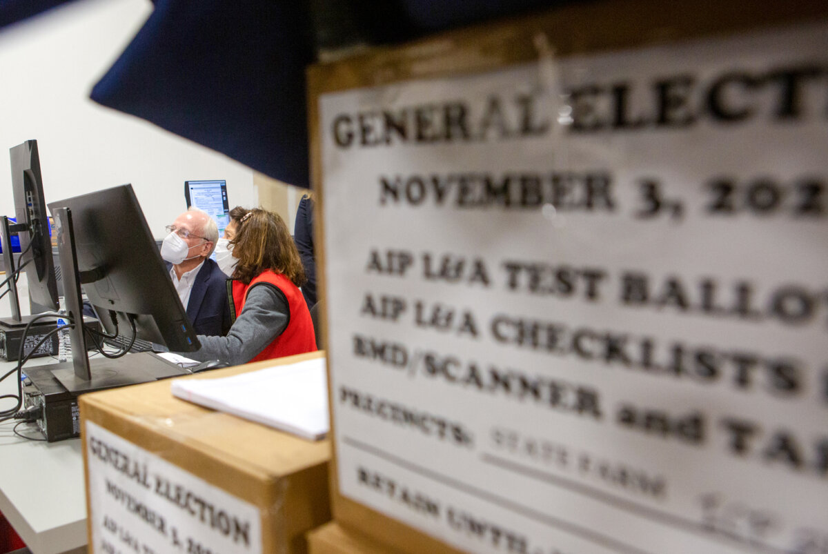 Members of an adjudication review panel examine scanned absentee ballots at the Fulton County Election Preparation Center in Atlanta on Nov. 4, 2020. (Jessica McGowan/Getty Images)