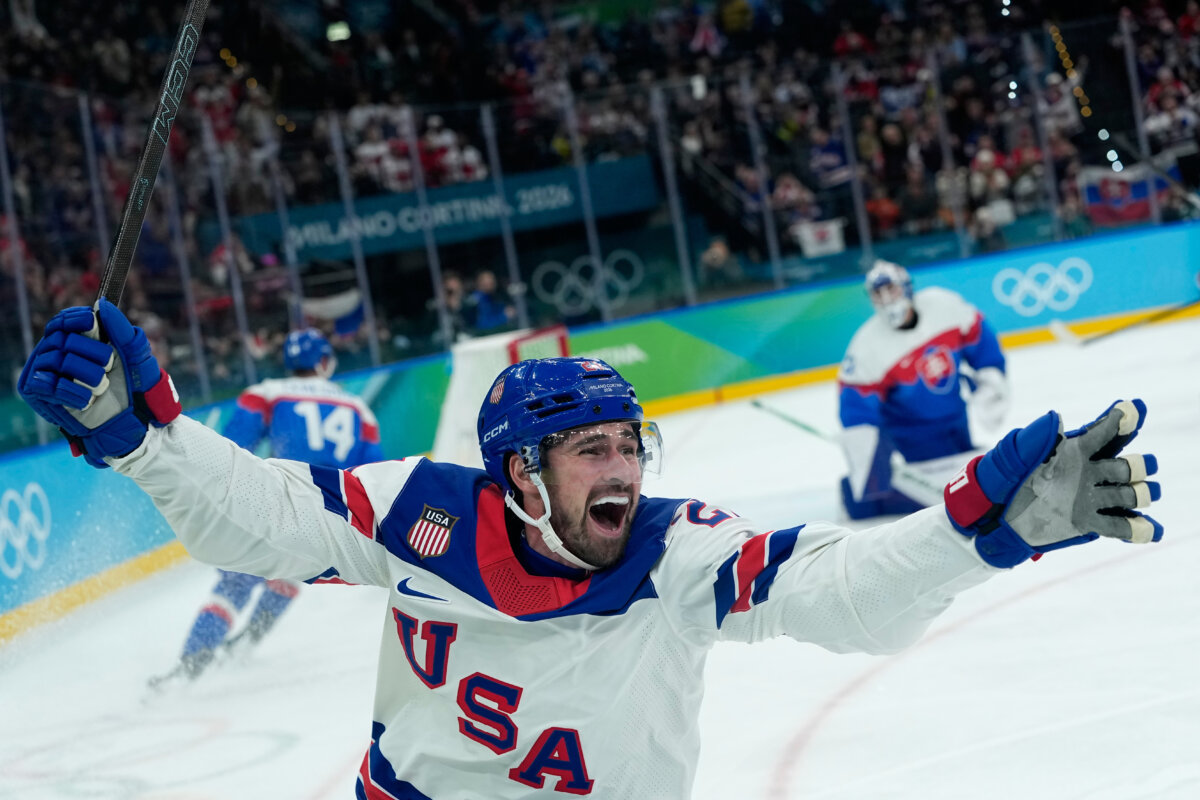 United States' Dylan Larkin (21) celebrates after scoring the opening goal during a men's ice hockey semifinal game between United States and Slovakia at the 2026 Winter Olympics, in Milan, Italy, on Feb. 20, 2026. (Petr David Josek/AP Photo)