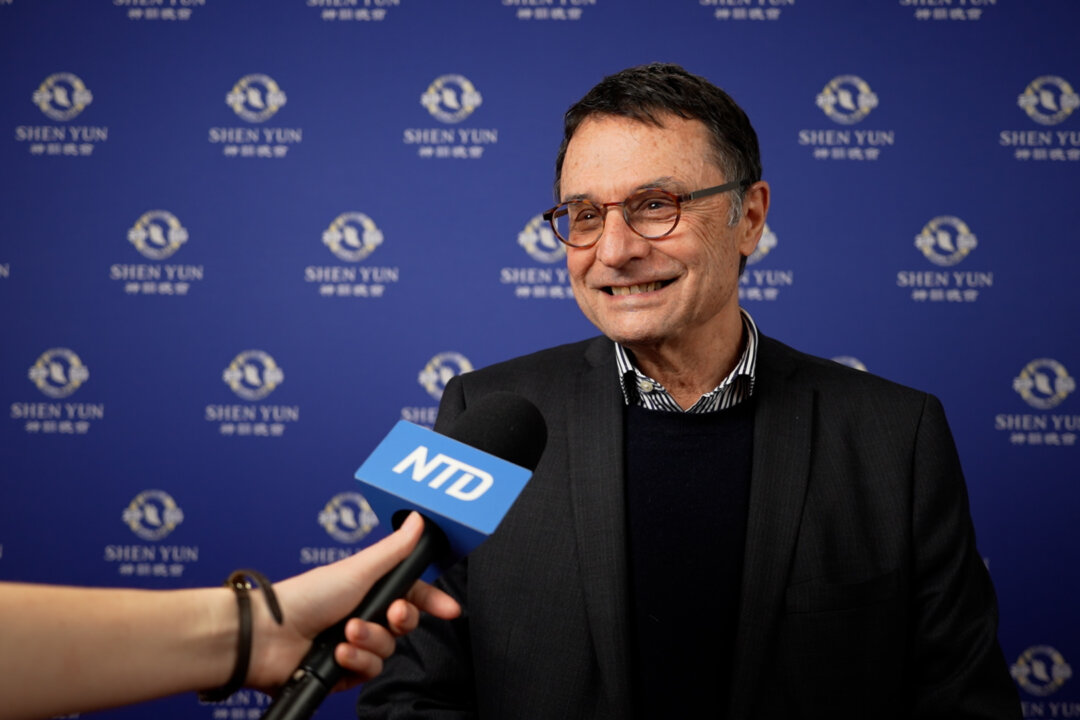 Charles Selleger, a former physician and member of the Grand Council of the Canton of Geneva, experiences Shen Yun Performing Arts in Lausanne, Switzerland, on Feb. 20, 2026. (NTD)