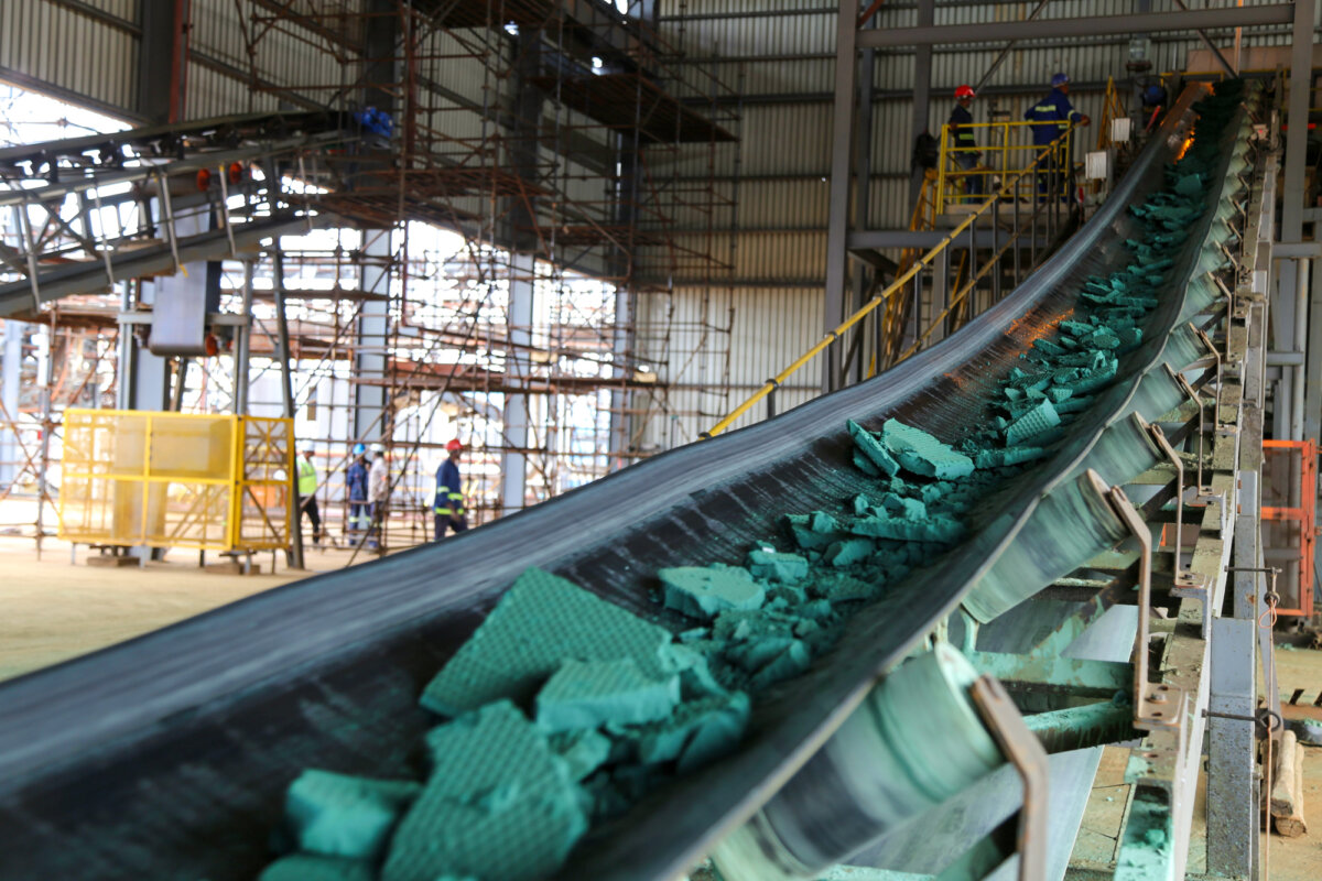 Chunks of raw cobalt move along a conveyor belt after initial processing at a plant before being exported, mainly to China, for refining in Lubumbashi, Democratic Republic of the Congo (DRC), on Feb. 16, 2018. The DRC is the world’s leading source of mined cobalt. (Samir Tounsi/AFP via Getty Images)