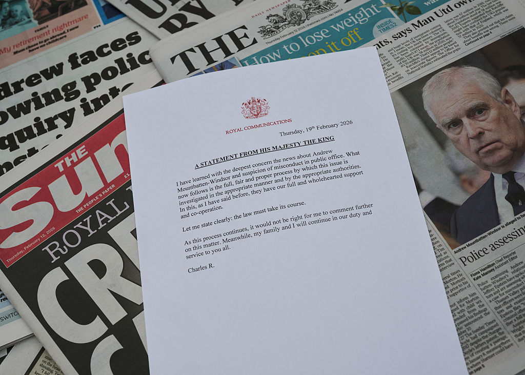 In this photo illustration, a statement from His Majesty King Charles III via communications at Buckingham Palace pledges his "full and wholehearted support and co-operation" to the "appropriate authorities" in response to the arrest of his brother, Andrew Mountbatten-Windsor, on suspicion of misconduct in public office in London, England on Feb. 19, 2026. (Gareth Cattermole/Getty Images)