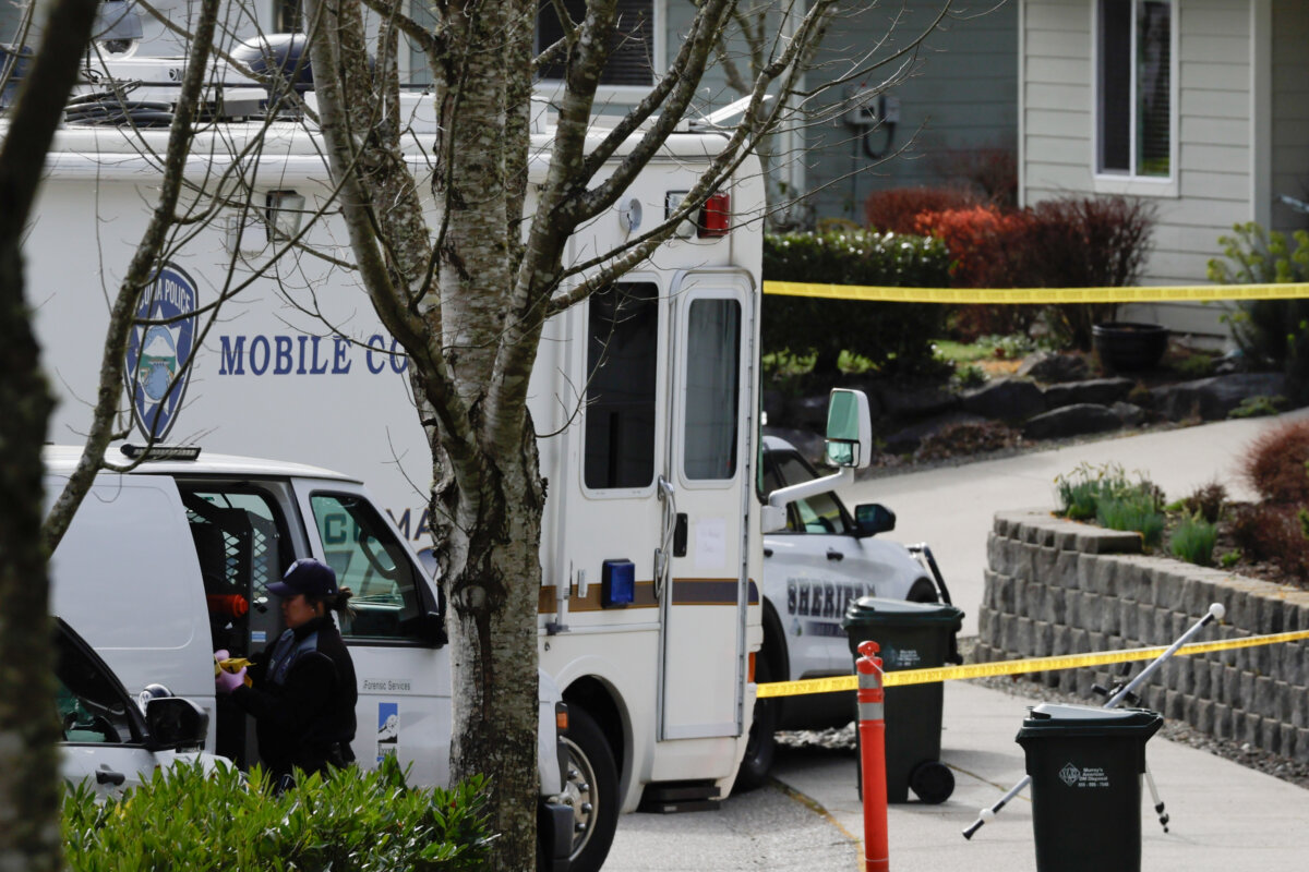 Authorities investigate the scene after reports that a man fatally stabbed multiple people, on Feb. 24, 2026, in Gig Harbor, Wash. (John Froschauer/AP Photo)