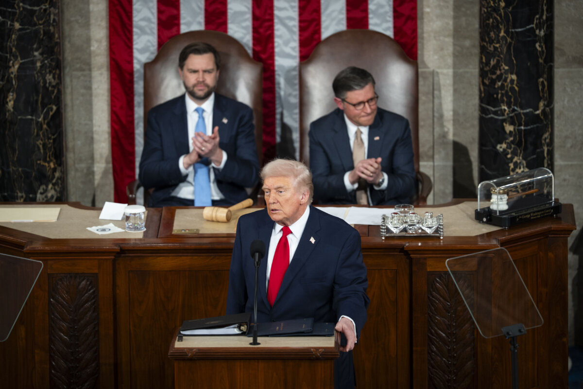Vice President JD Vance (L) and House Speaker Mike Johnson (R-La.) (R) listen to President Donald Trump deliver his first State of the Union address during his second presidential term, in the House Chamber on Capitol Hill in Washington on Feb. 24, 2026. (Madalina Kilroy/The Epoch Times)