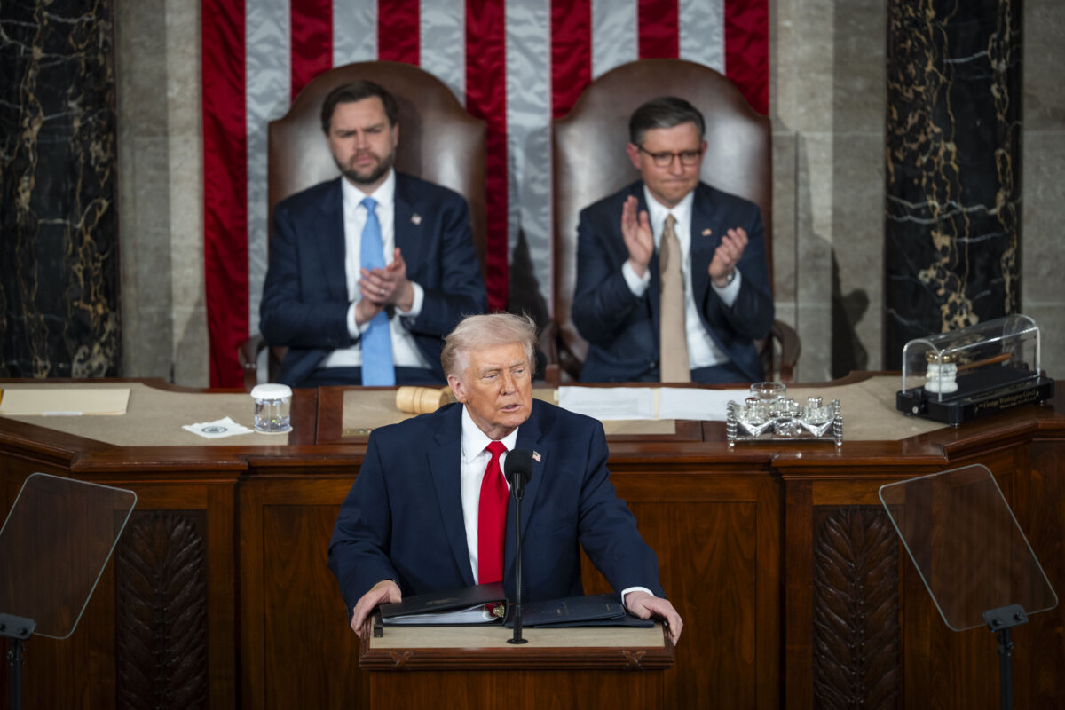 Vice President JD Vance (L) and House Speaker Mike Johnson (R-La.) listen to President Donald Trump deliver his first State of the Union address during his second presidential term, in the House Chamber on Capitol Hill in Washington on Feb. 24, 2026. (Madalina Kilroy/The Epoch Times)