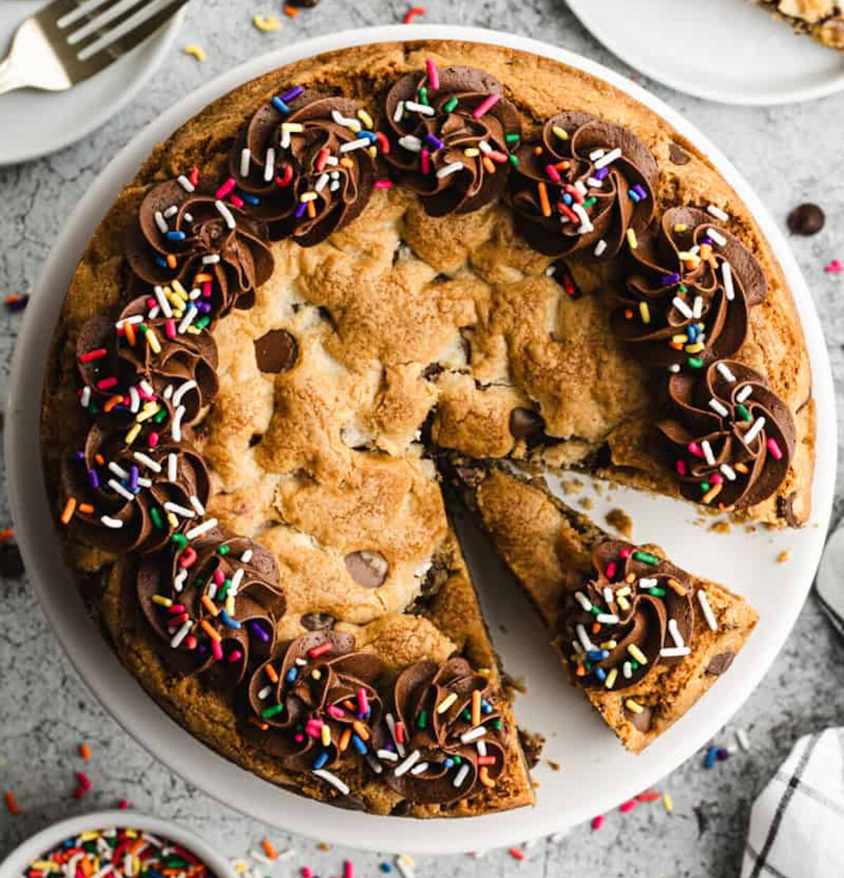 Learn how to make a Cookie Cake that is soft, chewy, and a fraction of the store-bought cost! Make it for birthdays, game day, or any special occasion. (Lauren Allen)