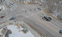 Sinkhole Opens at Omaha Intersection, Swallowing SUV and Pickup Truck