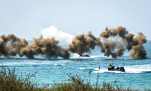 Day in Photos: Amphibious Drill in Thailand, Protests in Greece, and Festival of Colours