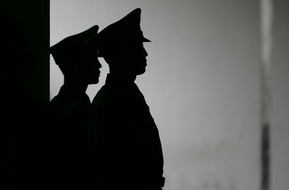 Chinese paramilitary policemen stand guard near Tiananmen Square in Beijing on Sept. 30, 2005. (Peter Parks/AFP via Getty Images)