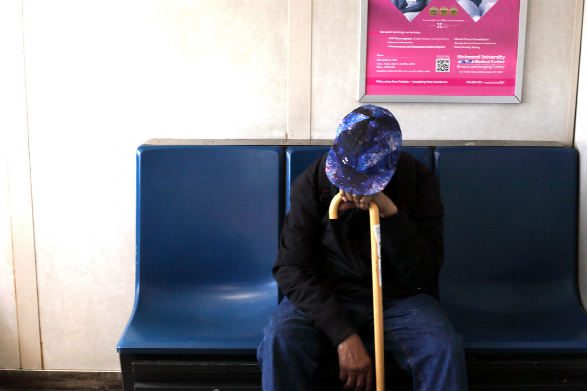 An old man rests on his cane on the ferry in New York City, on April 17, 2025. (Daniel Perron/Hans Lucas/AFP via Getty Images)