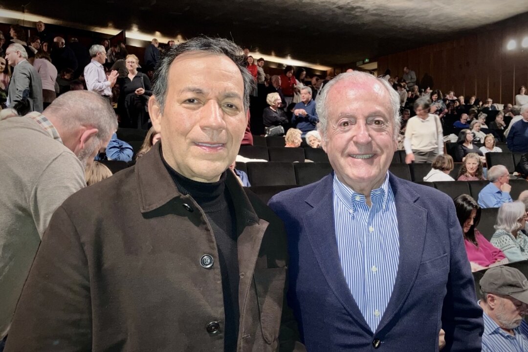 Eduardo Santos Guada (R) together with José Rafael Rojas Romero enjoyed a Shen Yun performance at the Teatro Auditorio San Lorenzo de El Escorial in Spain, on Feb. 26. 2026. (Bartolomé Suau/The Epoch Times)