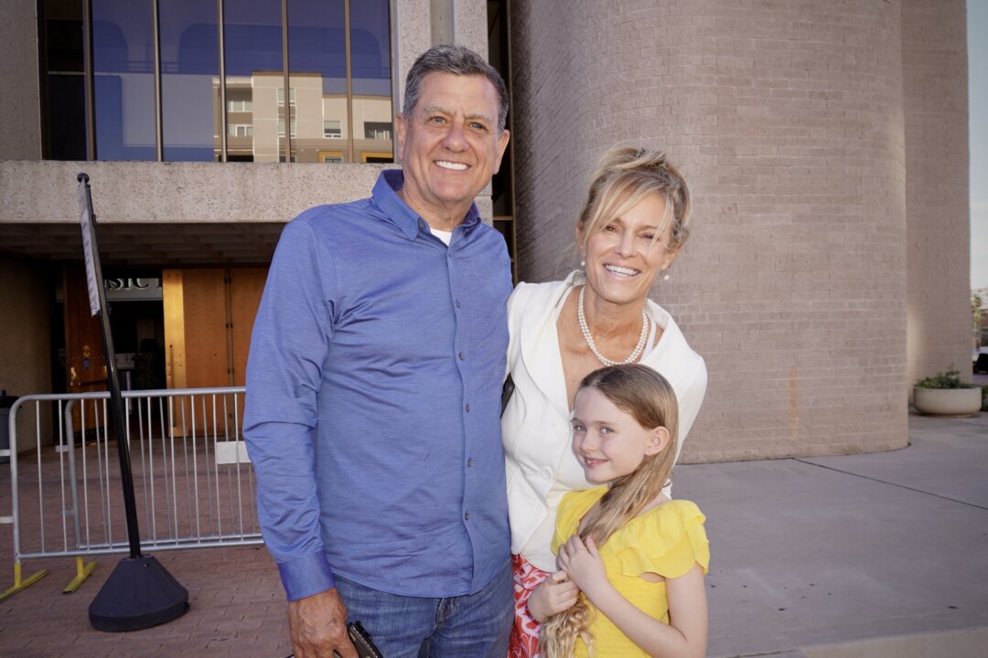Rudy and Kellie Ing with their granddaughter Paisley outside the Linda Ronstadt Music Hall in Tucson, Ariz., on Feb. 28, 2026. (Lily Yu/The Epoch Times)
