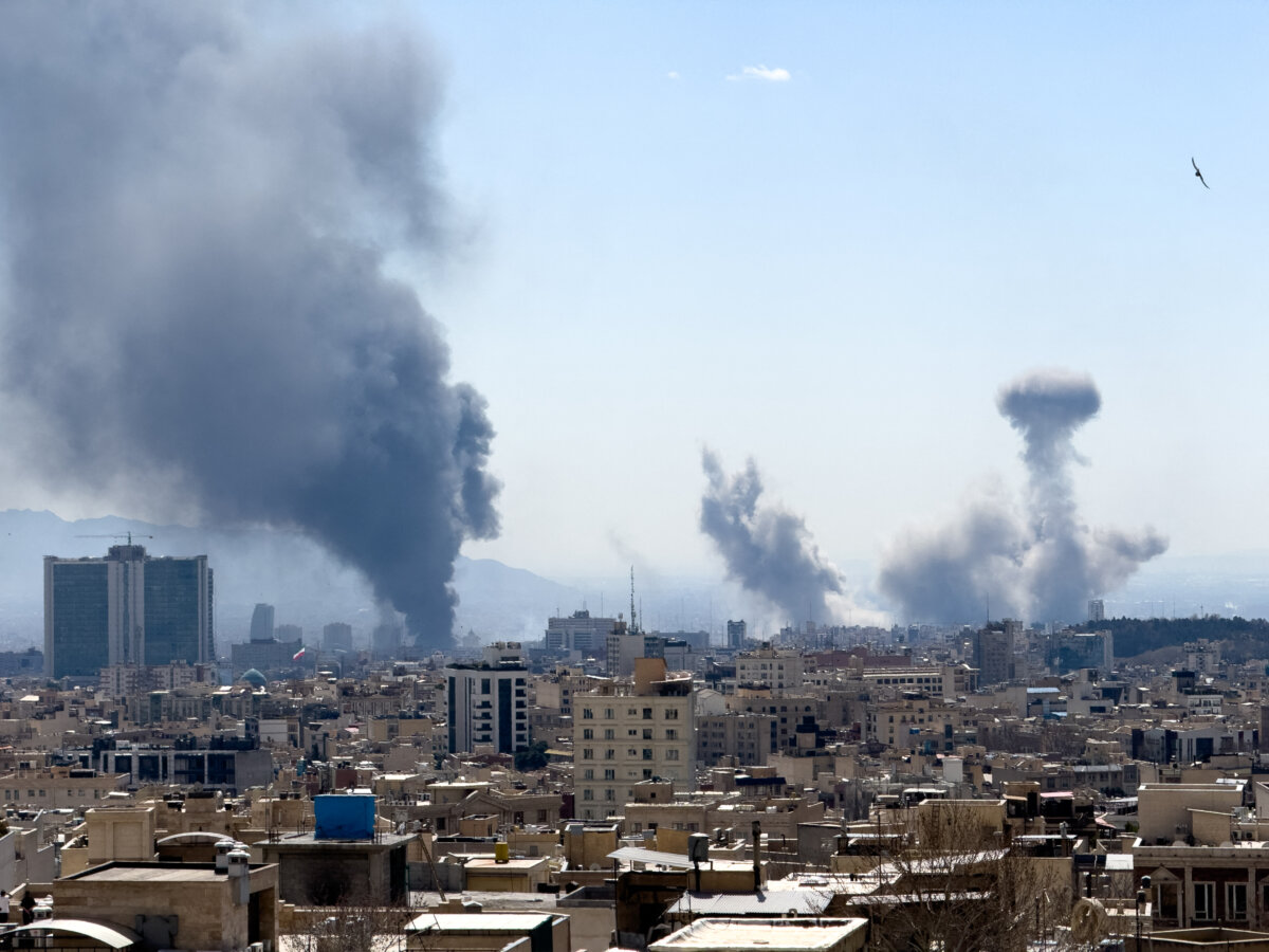 Plumes of smoke rise following reported explosions in Tehran, Iran, on March 1, 2026. (Mahsa/Middle East Images / AFP via Getty Images)