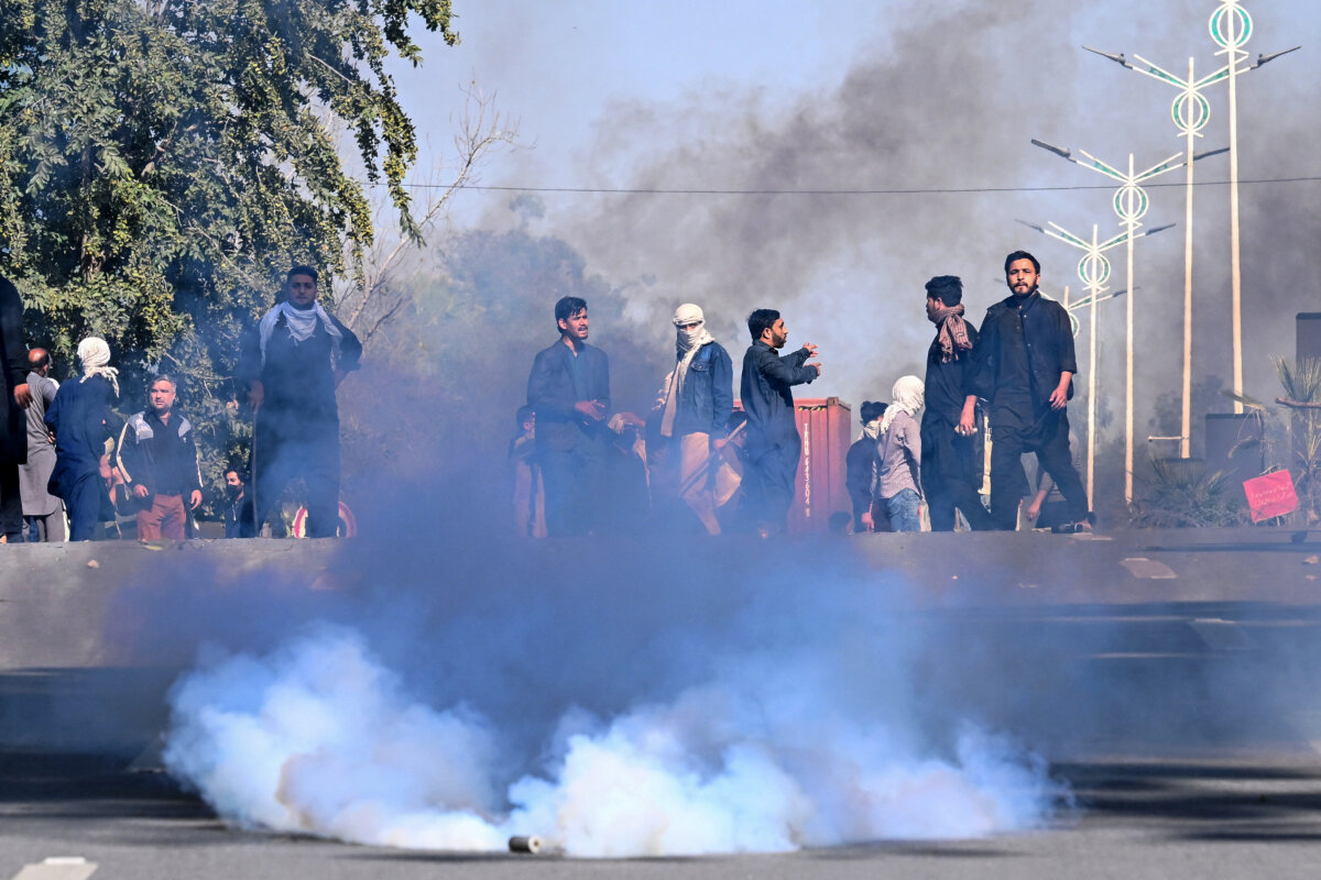 Protesters disperse after riot police fired tear gas shells during their attempt to storm the U.S. embassy in Islamabad on March 1, 2026, following the death of Iran's supreme leader Ayatollah Ali Khamenei amid U.S.-Israel strikes. At least nine people were killed during pro-Iran protests at the U.S. consulate in Karachi. (Aamir Qureshi/AFP via Getty Images)