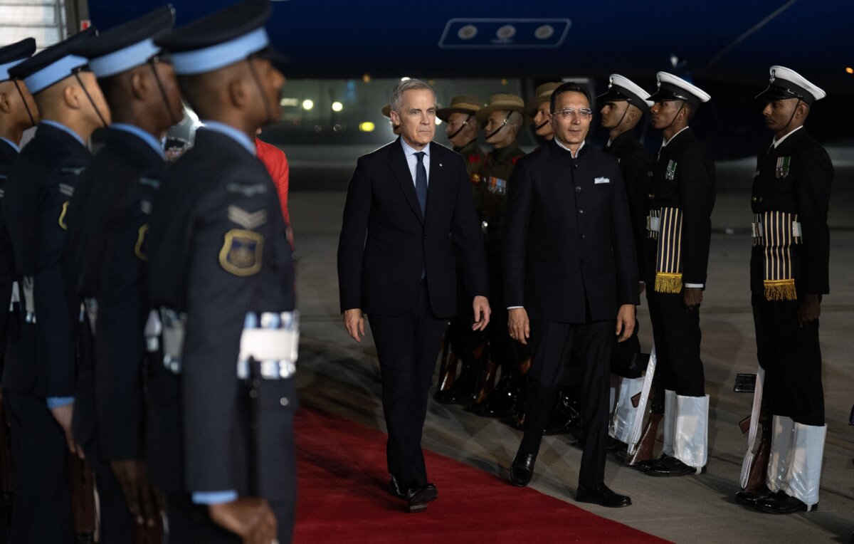 Canadian Prime Minister Mark Carney, (CL), arrives in New Delhi, India on March 1, 2026. (The Canadian Press/Adrian Wyld)