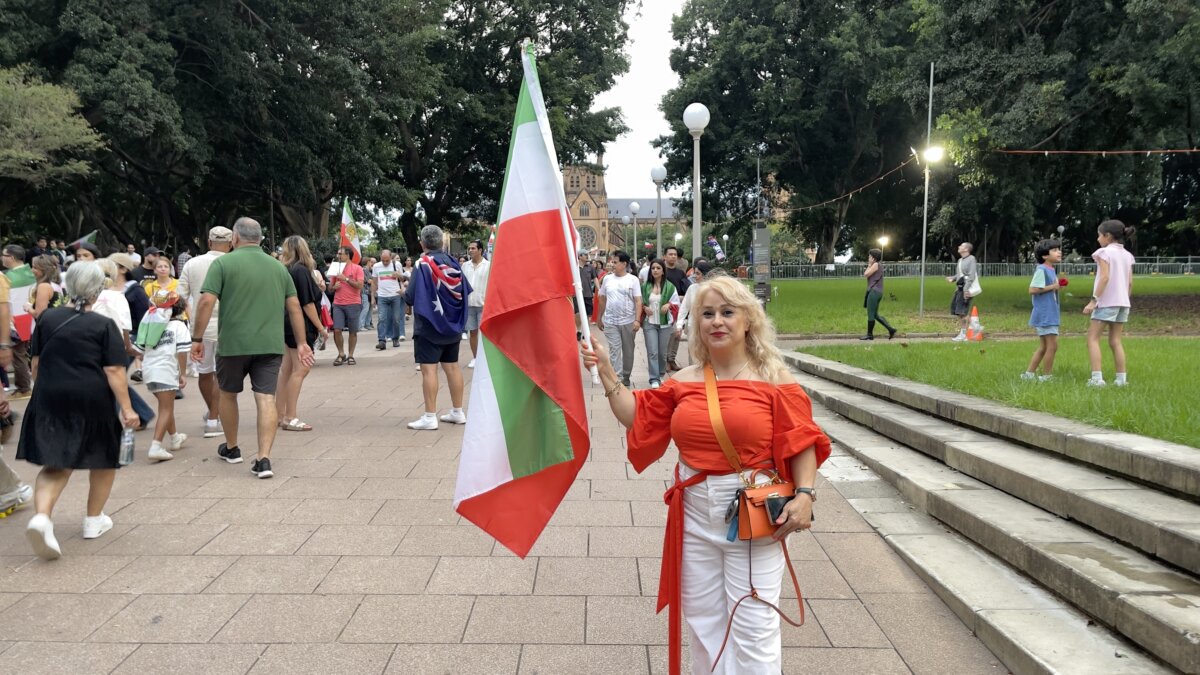 Iranian-Australian woman Nazgol Yazdi takes to the streets of Sydney, Australia, on March 1, 2026 to celebrate U.S. and Israeli action in Iran. (Adam Chiang/The Epoch Times)