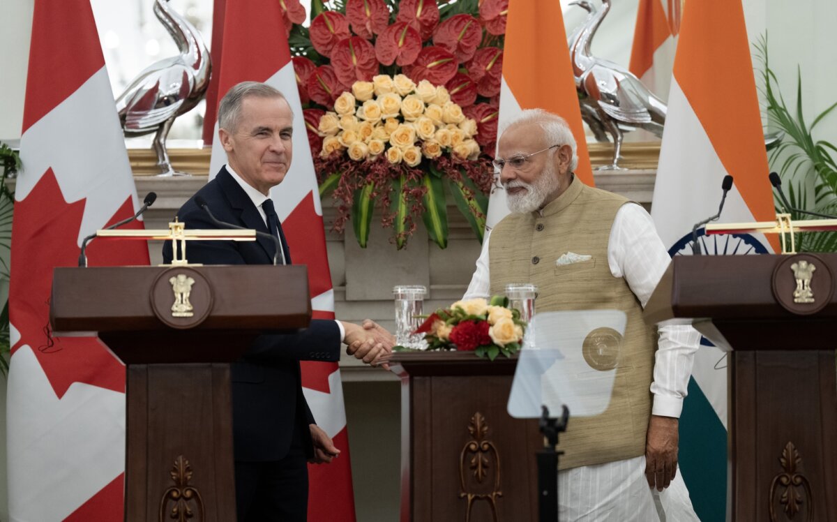 Prime Minister Mark Carney and Indian Prime Minister Narendra Modi shake hands following the presentation of agreements and joint statements in New Delhi, India on March 2, 2026. (The Canadian Press/Adrian Wyld)