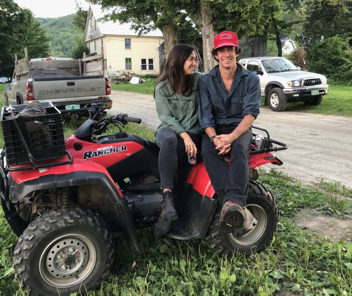 Farmers Neil and Ahn Ryan take a break on a four-wheeler at MacIsaac Highland Cattle farm in Corinth, Vt. (Courtesy of Neil Ryan)