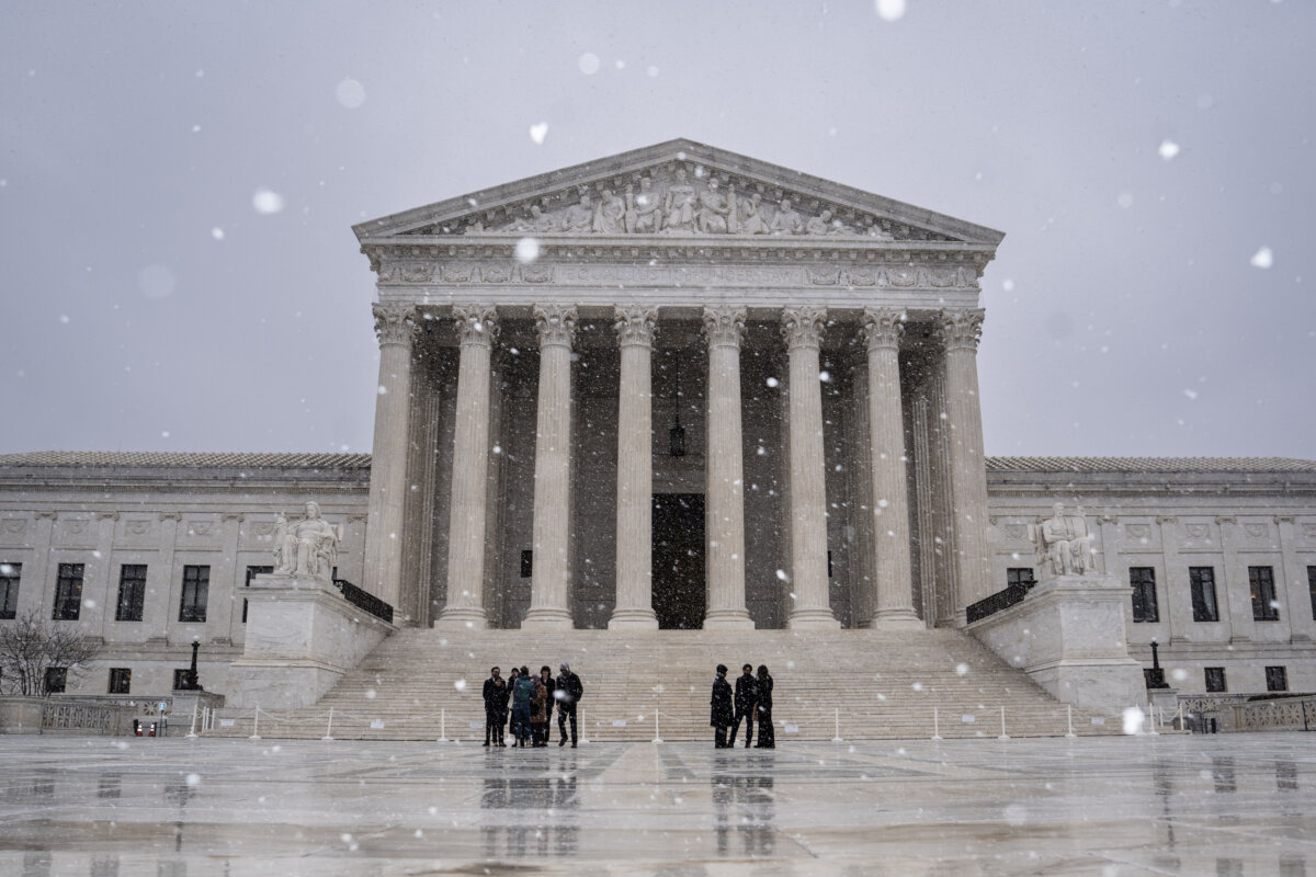 Snow falls outside the Supreme Court in Washington on March 2, 2026. (Madalina Kilroy/The Epoch Times)