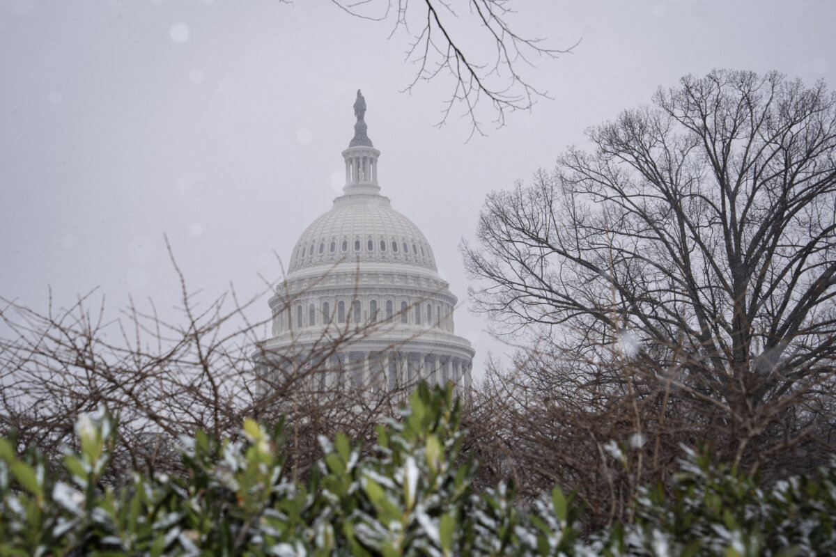 Snow falls outside of the U.S. Capitol building in Washington on March 2, 2026. (Madalina Kilroy/The Epoch Times)