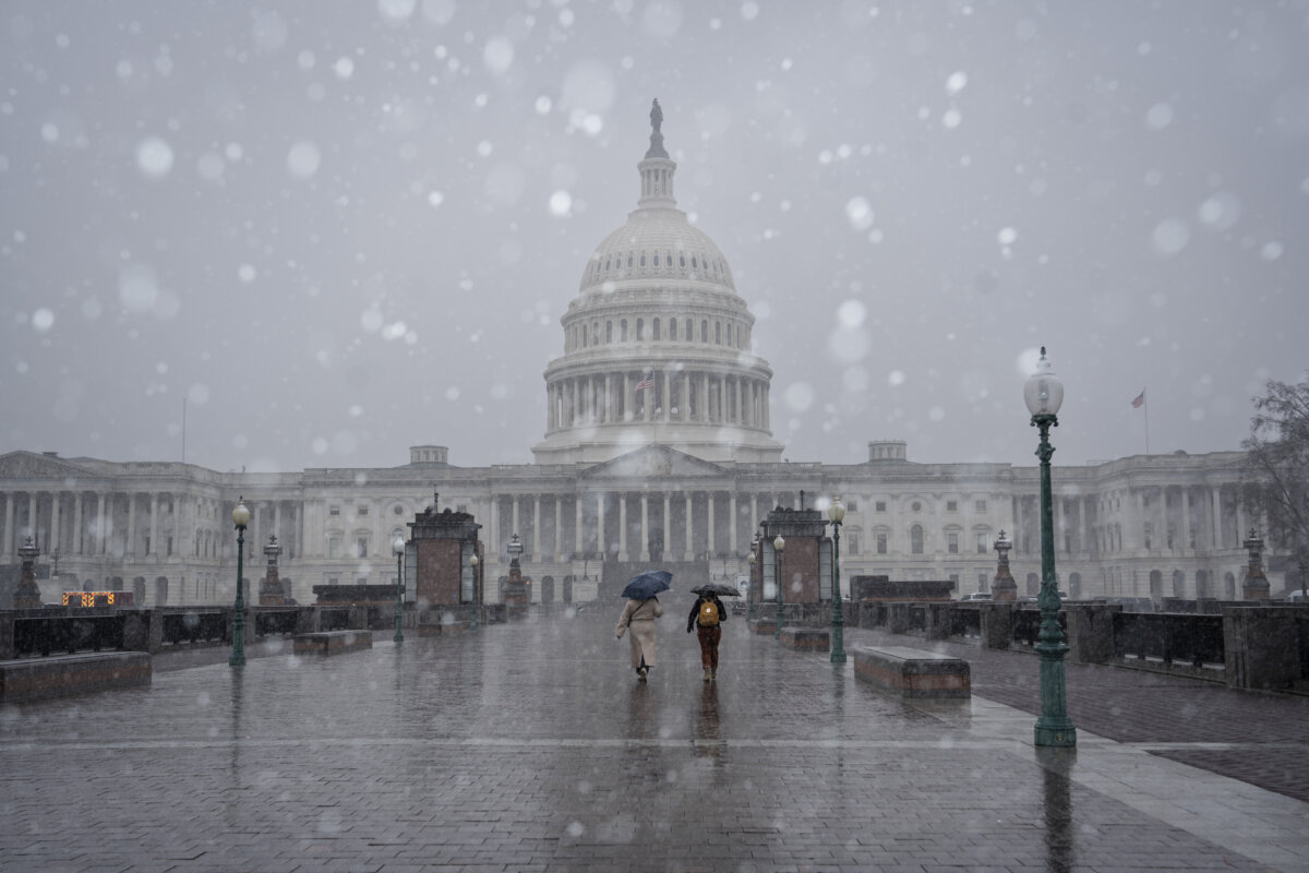 Snow falls outside of the U.S. Capitol on March 2, 2026. (Madalina Kilroy/The Epoch Times)
