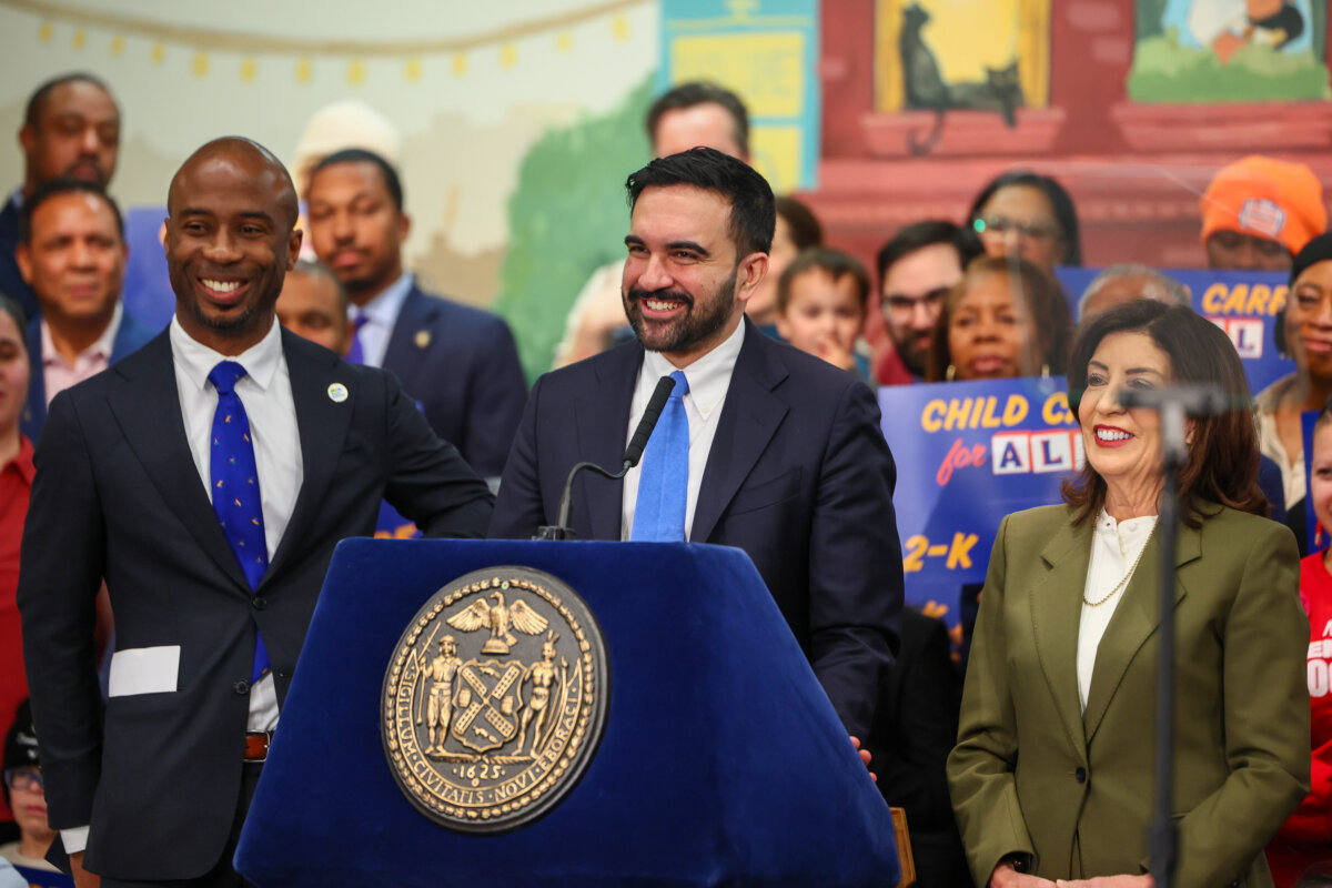 New York City Mayor Zohran Mamdani (C) speaks at a press conference with other officials and supporters, including New York Schools Chancellor Kamar Samuels (L) and New York Gov. Kathy Hochul (R), in New York City on March 3, 2026. (Michael M. Santiago/Getty Images)