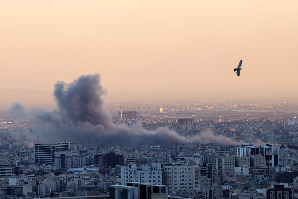 A plume of smoke rises after a strike on the Iranian capital Tehran on March 3, 2026. (Atta Kenare/AFP via Getty Images)