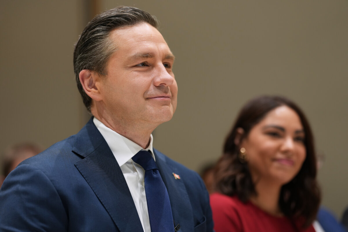 Conservative Leader Pierre Poilievre and his wife, Anaida Galindo, attend an event in Berlin, Germany, on March 4, 2026. (AP Photo/Markus Schreiber)