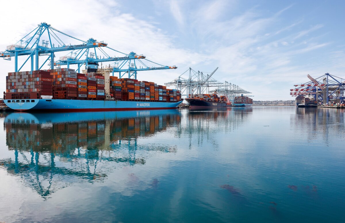 Shipping cranes stand above container ships loaded with shipping containers at the Port of Los Angeles on Feb. 20, 2026. (Mario Tama/Getty Images)