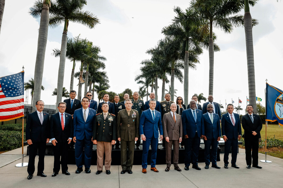 White House Deputy Chief of Staff for Policy Stephen Miller (5th R), Defense Secretary Pete Hegseth (C), and Army Gen. Francis Donovan (5th L), commander of U.S. Southern Command, pose for a photo with leaders during the inaugural Americas Counter Cartel Conference at SOUTHCOM headquarters in Doral, Fla., on March 5, 2026. (Eva Marie Uzcategui/AFP via Getty Images)