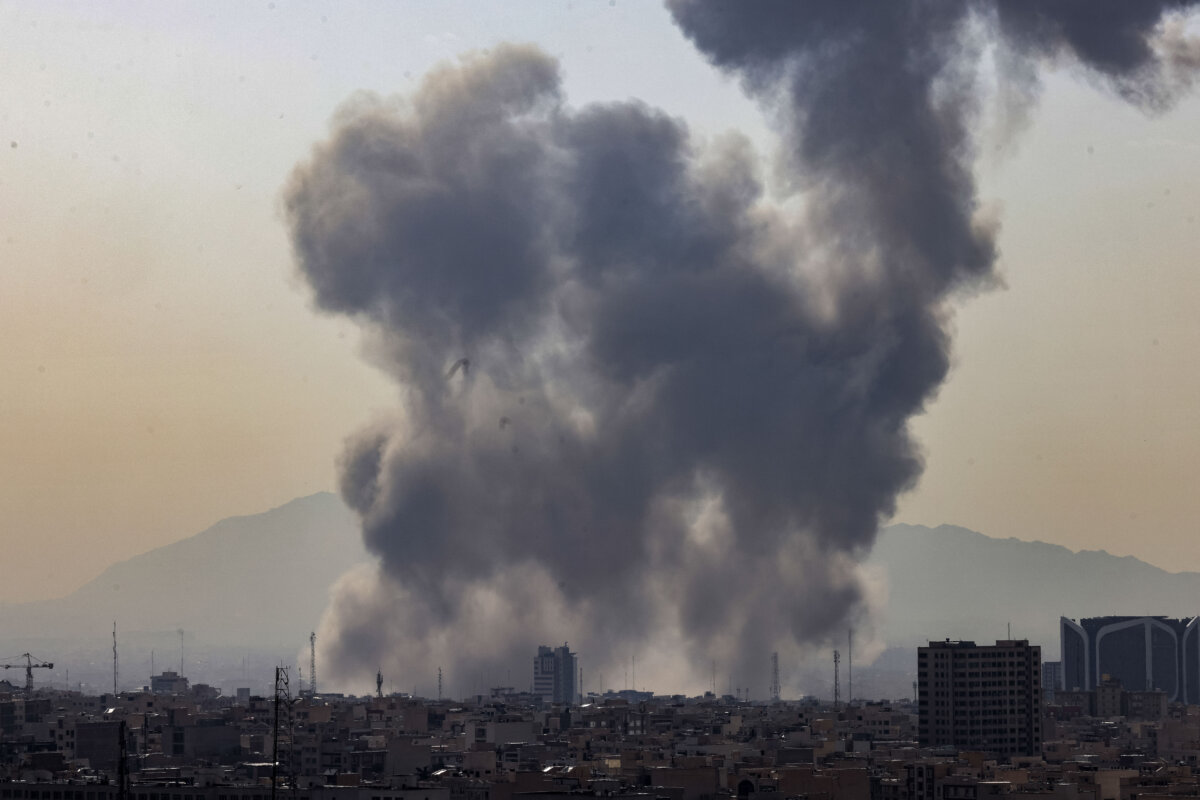 A plume of smoke rises following a reported explosion in Tehran, Iran, on Feb. 28, 2026. (ATTA KENARE/AFP via Getty Images)