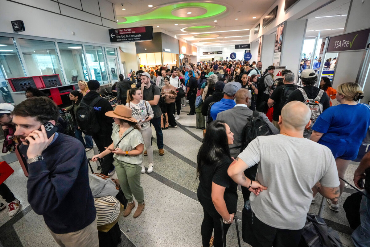 Airline passengers wait in long lines to get through the TSA security screening at William P. Hobby Airport in Houston on March 8, 2026. (Brett Coomer/Houston Chronicle via AP)