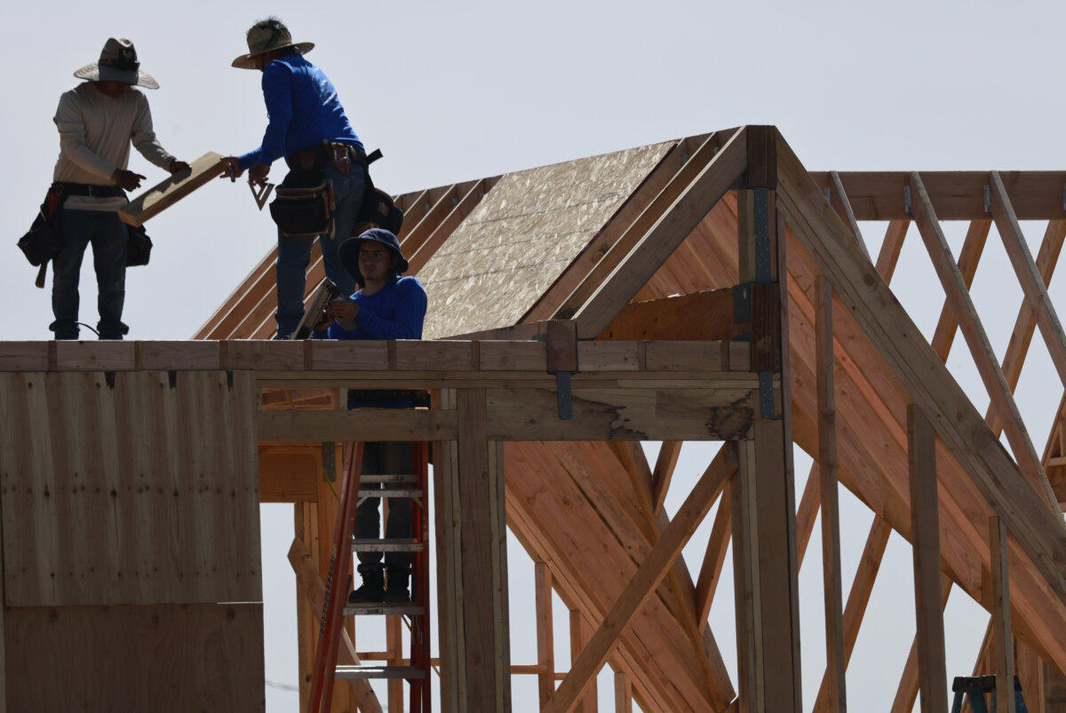 Workers rebuild a home in the Eaton Fire burn zone in Altadena, Calif., on March 6, 2026. (Mario Tama/Getty Images)