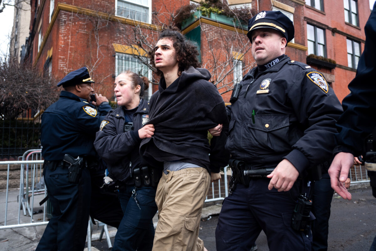 Police detain Emir Balat after he attempted to detonate an improvised explosive device during a counterprotest against far right influencer Jake Lang staging an anti-Islam protest outside Gracie Mansion in New York City on March 7, 2026. (Julius Constantine Motal/AP Photo)
